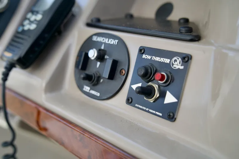  Yacht Photos Pics Control panel of a 2000 Carver 506 Motor Yacht featuring searchlight and bow thruster controls.