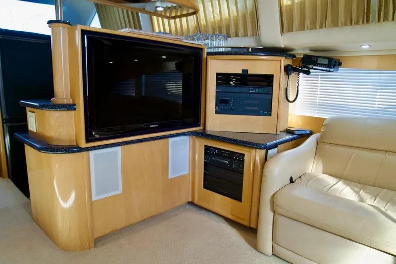  Yacht Photos Pics Luxurious interior of 2000 Carver 506 Motor Yacht with entertainment system and plush seating.