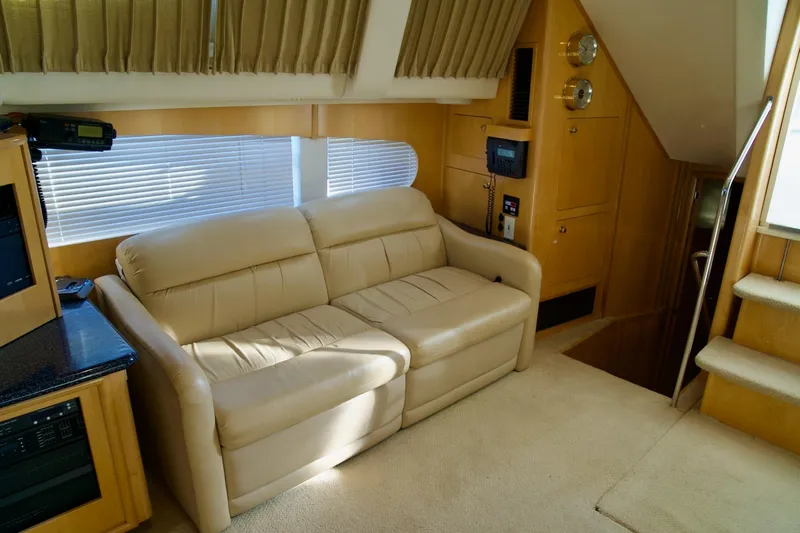 Yacht Photos Pics Interior of 2000 Carver 506 Motor Yacht with beige sofa and wooden accents.