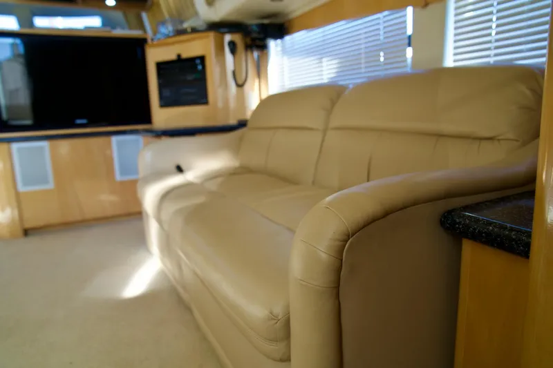  Yacht Photos Pics Luxurious interior of 2000 Carver 506 Motor Yacht with beige leather sofa.