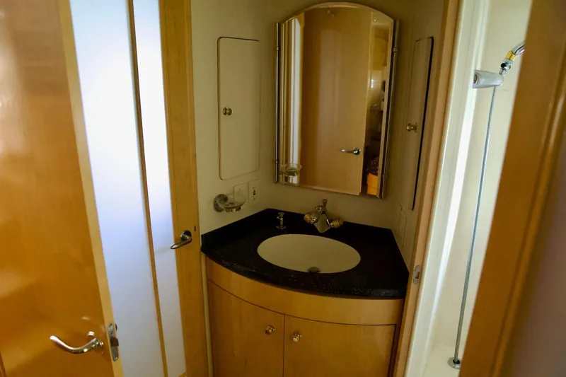  Yacht Photos Pics Bathroom interior of 2000 Carver 506 Motor Yacht with sink and mirror.