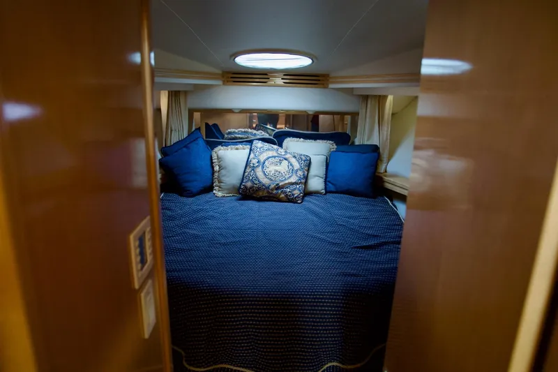 Yacht Photos Pics Luxurious bedroom in 2000 Carver 506 Motor Yacht with elegant blue bedding.