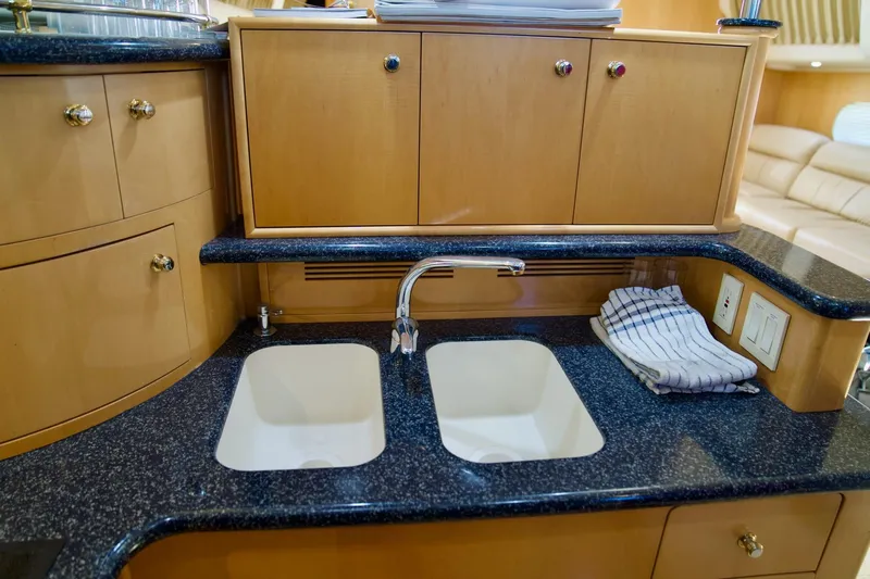  Yacht Photos Pics Luxurious kitchen sink area in 2000 Carver 506 Motor Yacht with dual basins.