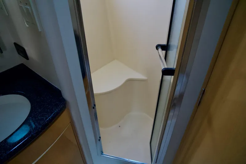  Yacht Photos Pics Shower area in 2000 Carver 506 Motor Yacht with glass door and corner seat.