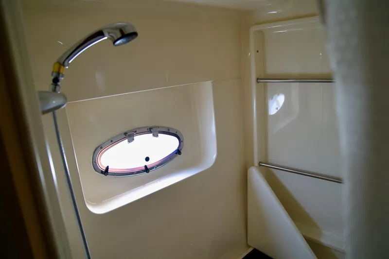  Yacht Photos Pics Bathroom interior of 2000 Carver 506 Motor Yacht with shower and porthole window.