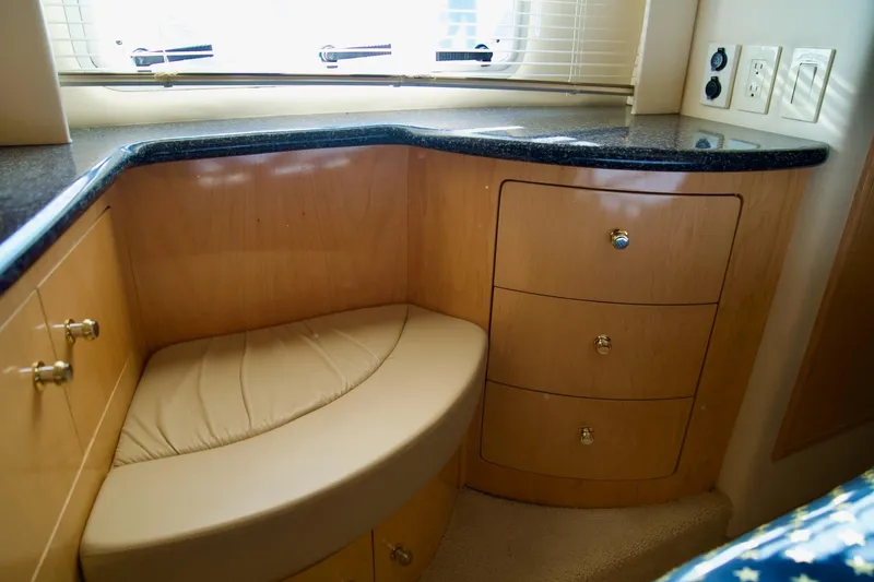  Yacht Photos Pics Interior of 2000 Carver 506 Motor Yacht with wood cabinetry and cushioned seating.