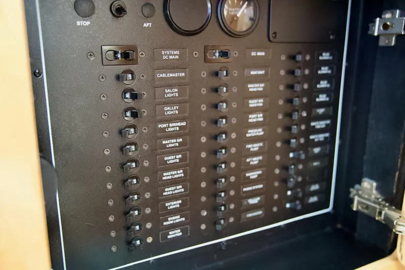  Yacht Photos Pics Electrical panel of a 2000 Carver 506 Motor Yacht with labeled switches and gauges.
