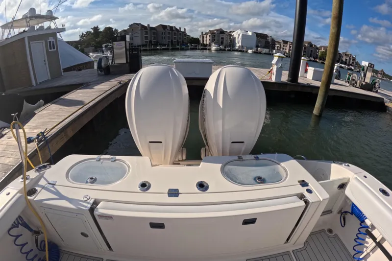  Yacht Photos Pics 2020 Cobia 350 Center Console at dock with twin engines and live wells.