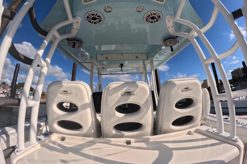  Yacht Photos Pics 2020 Cobia 350 Center Console boat interior with white seating and overhead speakers.