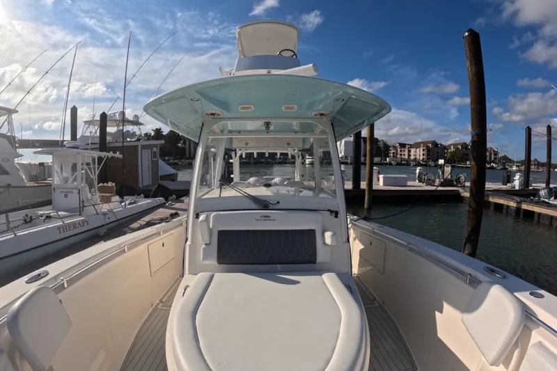  Yacht Photos Pics 2020 Cobia 350 Center Console boat docked at marina under blue sky.