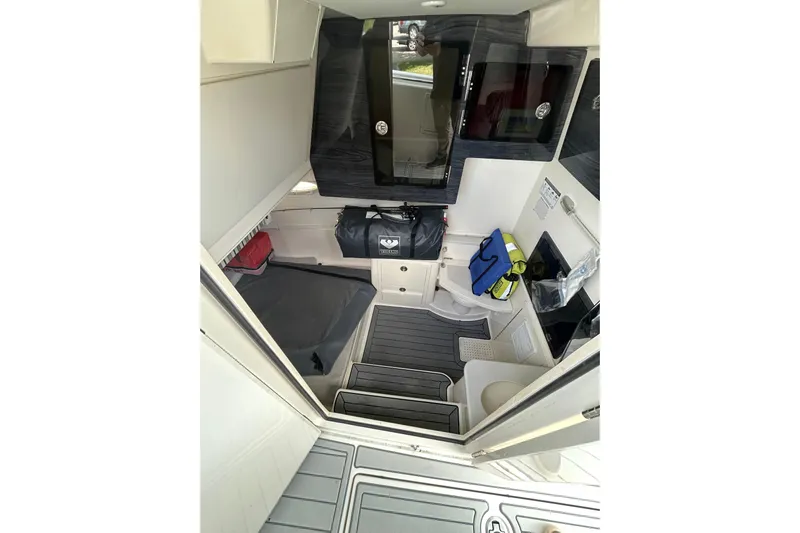  Yacht Photos Pics 2020 Cobia 350 Center Console cabin interior with seating, storage, and modern amenities.