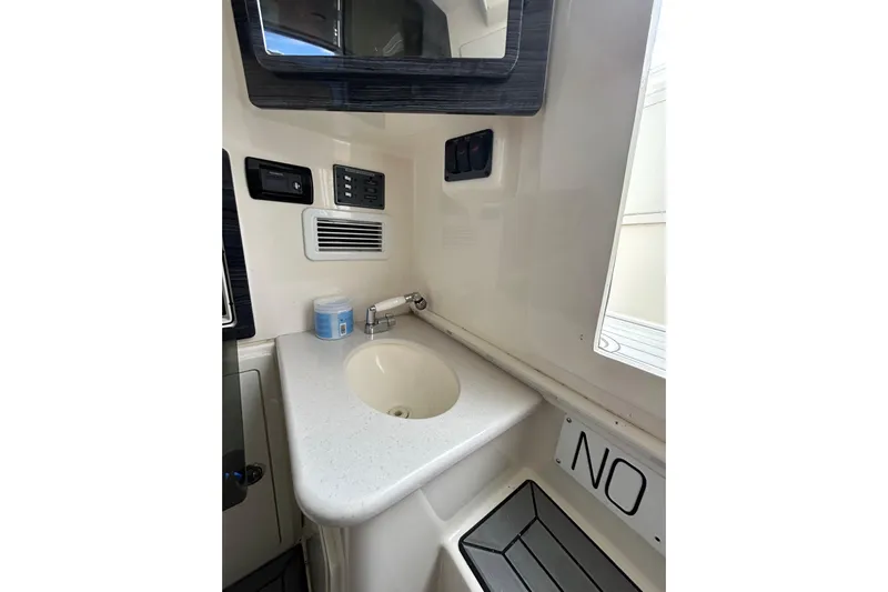  Yacht Photos Pics 2020 Cobia 350 Center Console boat interior with sink and control panel.