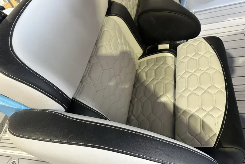  Yacht Photos Pics Luxurious seating in 2025 Nor-Tech 340 Sport Center Console boat, featuring hexagonal stitching.