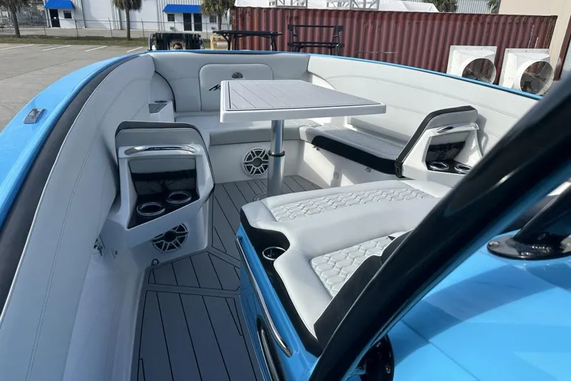  Yacht Photos Pics 2025 Nor-Tech 340 Sport Center Console interior with seating and table, featuring modern design.