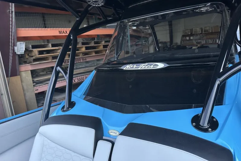  Yacht Photos Pics 2025 Nor-Tech 340 Sport Center Console boat interior with blue and gray seating.