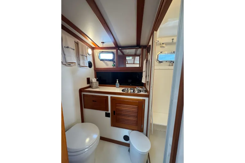 Gullywhumper Yacht Photos Pics 2001 Ellis 36 Flybridge bathroom with wooden accents and compact design.