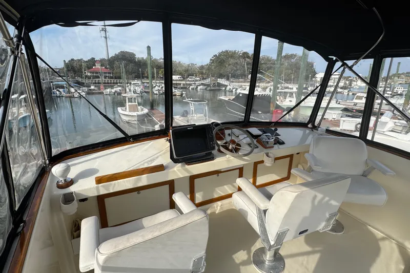 Gullywhumper Yacht Photos Pics Flybridge interior of 2001 Ellis 36, featuring helm and marina view.