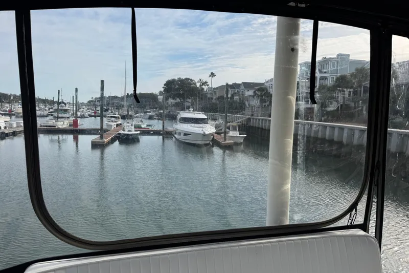 Gullywhumper Yacht Photos Pics View from Ellis 36 Flybridge, 2001 model, overlooking marina with boats and waterfront homes.