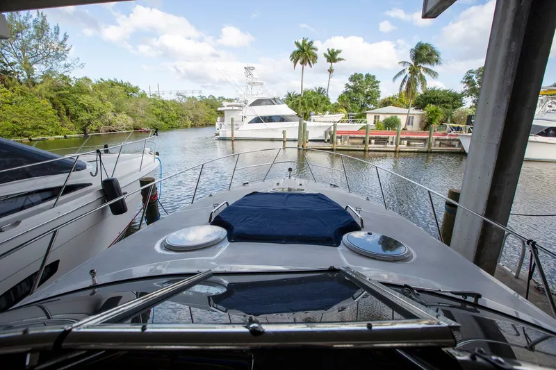  Yacht Photos Pics 2008 Regal 38 yacht docked in a scenic marina with palm trees and boats.