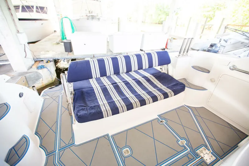  Yacht Photos Pics 2008 Regal 38 boat interior with striped seating and modern flooring.