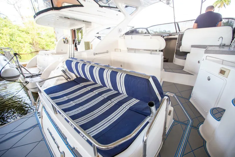  Yacht Photos Pics 2008 Regal 38 yacht interior with striped seating and modern amenities.