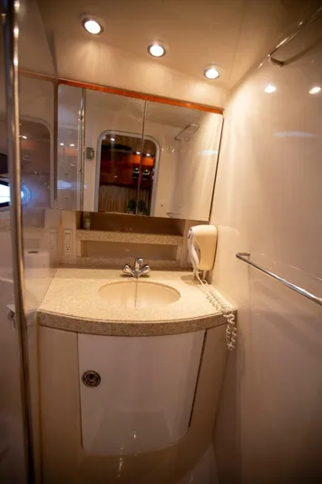  Yacht Photos Pics Luxurious bathroom in 2008 Regal 38 yacht with modern fixtures and elegant lighting.
