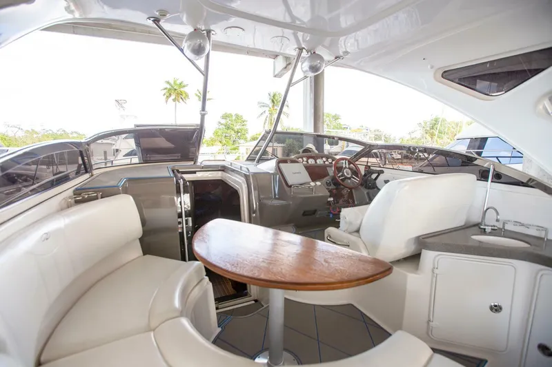  Yacht Photos Pics Interior of a 2008 Regal 38 yacht featuring a sleek seating area and modern helm.