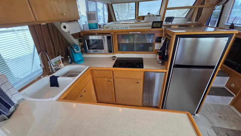 Toes In The Water Yacht Photos Pics Kitchen area in a 1998 Navigator 5300 yacht.