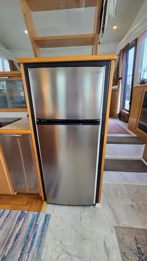 Toes In The Water Yacht Photos Pics Compact refrigerator in a 1998 Navigator 5300 yacht interior.