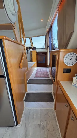 Toes In The Water Yacht Photos Pics Interior of a 1998 Navigator 5300 yacht with stairs and clock.