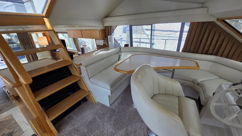Toes In The Water Yacht Photos Pics Interior of a 1998 Navigator 5300 yacht with elegant seating area.