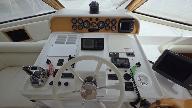 Toes In The Water Yacht Photos Pics Navigator 5300 1998 helm with instruments and controls.