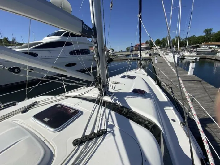 Yacht Photos Pics Sailboat docked at marina, Hunter 45 Center Cockpit, 2006 model, sunny day.
