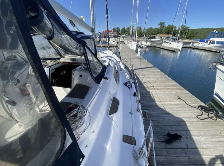 Yacht Photos Pics Sailboat docked at marina, 2006 Hunter 45 Center Cockpit, sunny day.
