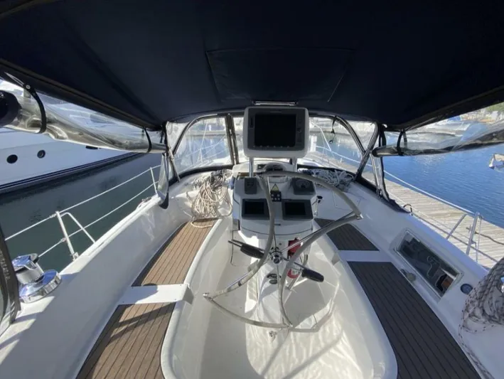  Yacht Photos Pics 2006 Hunter 45 Center Cockpit sailboat interior with navigation equipment and seating.