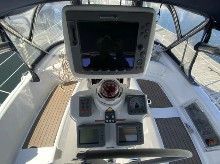  Yacht Photos Pics Cockpit of 2006 Hunter 45 Center Cockpit sailboat with navigation equipment and controls.