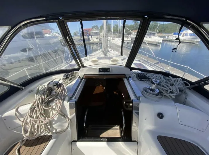  Yacht Photos Pics Cockpit view of a 2006 Hunter 45 Center Cockpit sailboat in a marina.