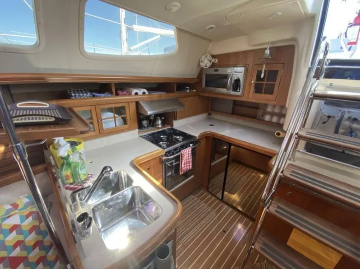 Yacht Photos Pics Interior of 2006 Hunter 45 Center Cockpit yacht kitchen with modern amenities.