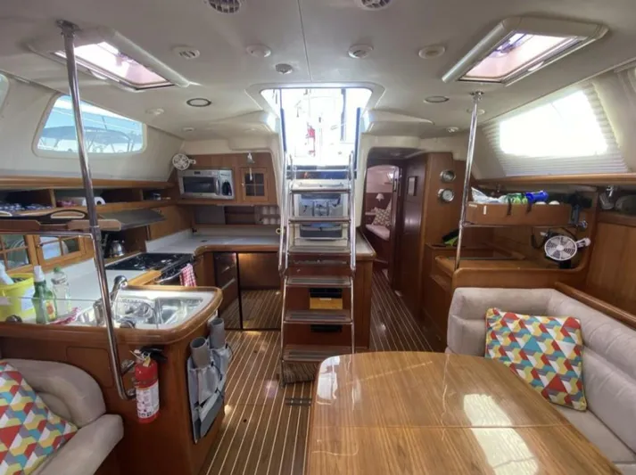  Yacht Photos Pics Interior of 2006 Hunter 45 Center Cockpit yacht with modern kitchen and seating area.