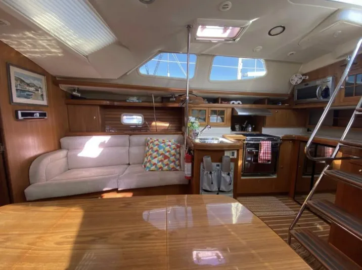 Yacht Photos Pics Interior of 2006 Hunter 45 Center Cockpit yacht with cozy seating and modern kitchen amenities.