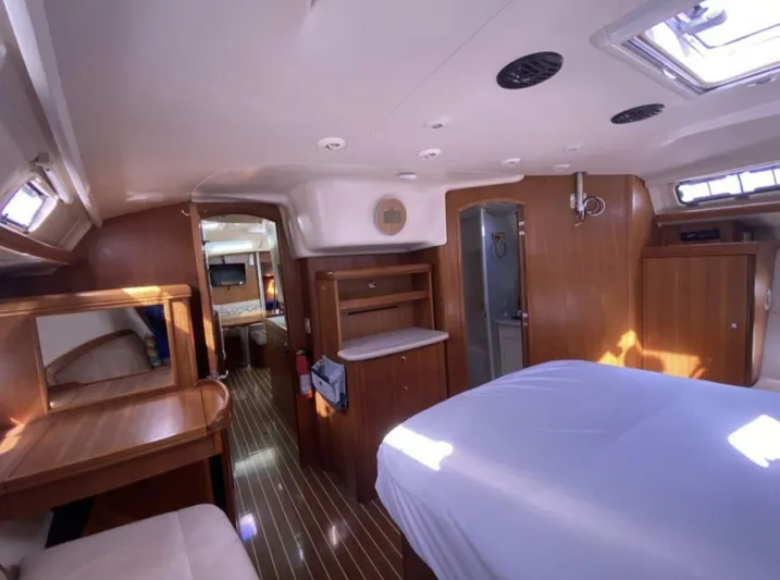  Yacht Photos Pics Interior of 2006 Hunter 45 Center Cockpit yacht with wood finish and spacious layout.