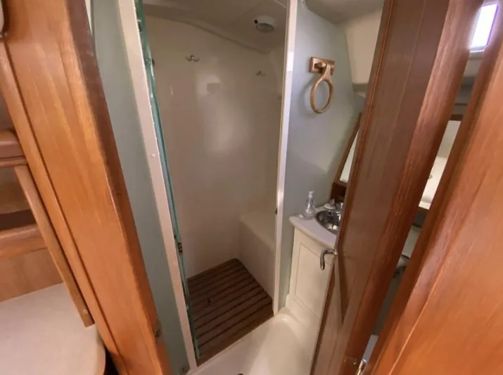  Yacht Photos Pics Interior of 2006 Hunter 45 Center Cockpit yacht showing bathroom with shower and sink.