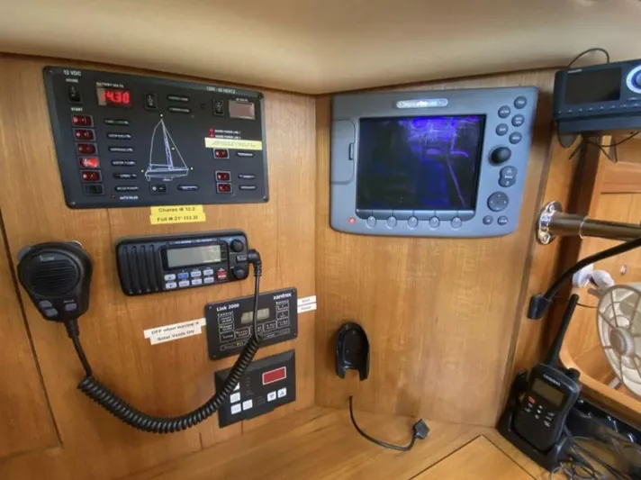  Yacht Photos Pics Control panel of 2006 Hunter 45 Center Cockpit sailboat with navigation and communication equipment.