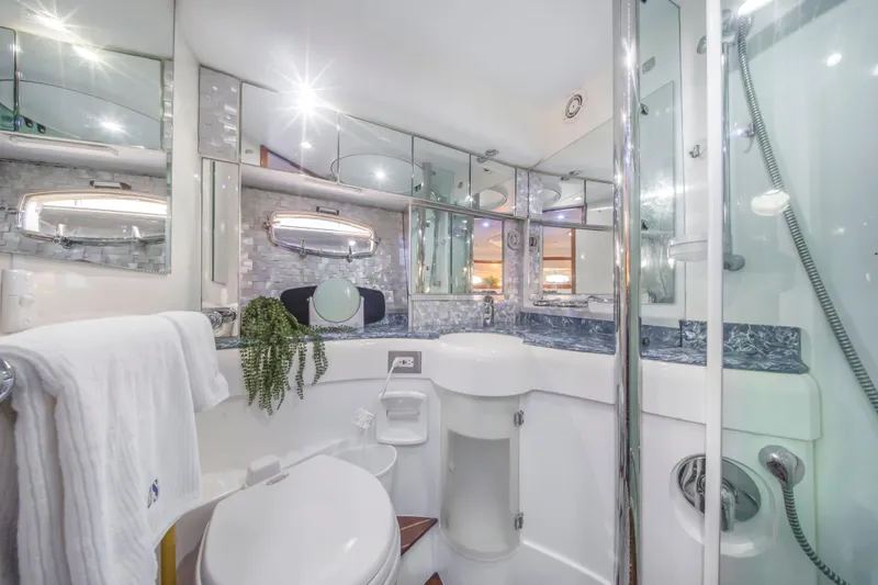 Just-us Yacht Photos Pics Luxurious 2009 Fairline Targa 52 yacht bathroom with modern fixtures and elegant design.