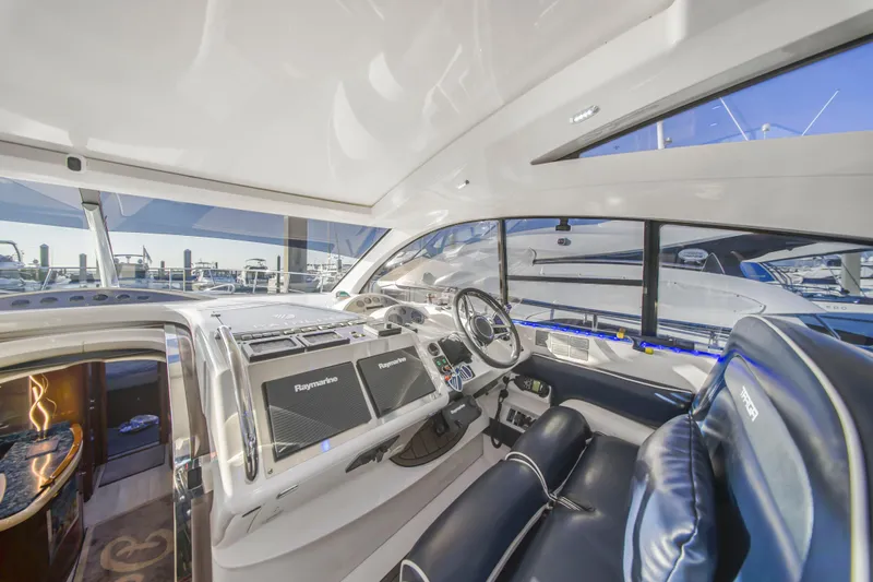Just-us Yacht Photos Pics Luxurious 2009 Fairline Targa 52 yacht interior with modern navigation equipment.