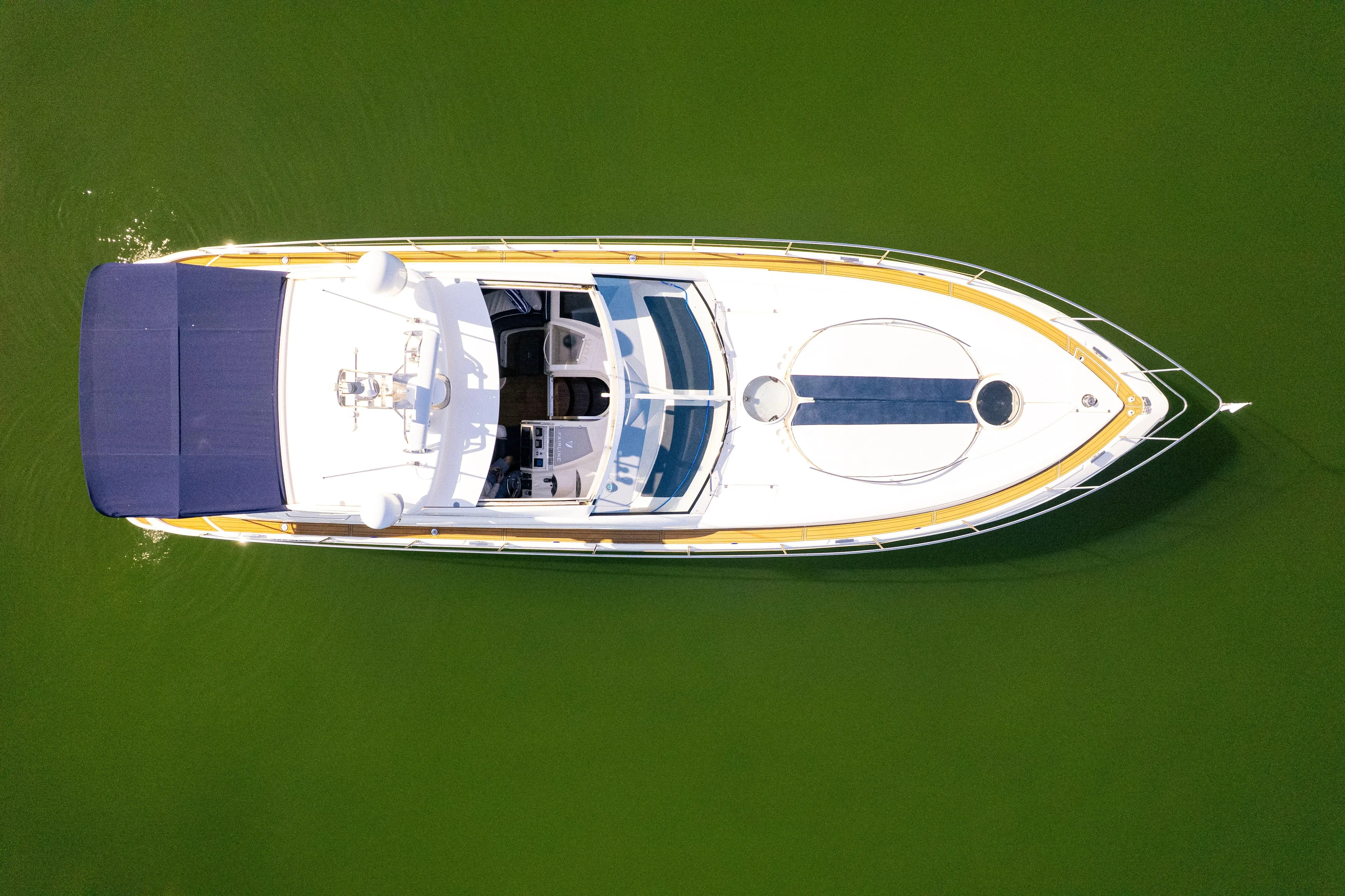Just-us Yacht Photos Pics Aerial view of 2009 Fairline Targa 52 yacht on green water.