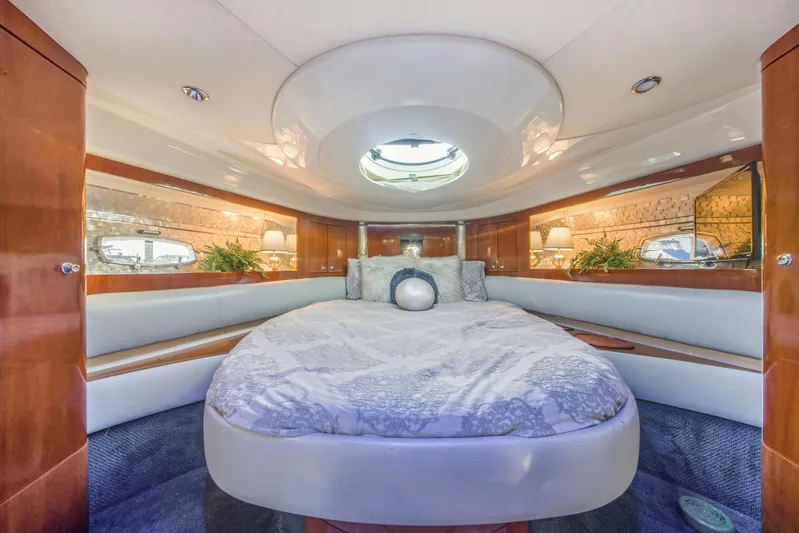 Just-us Yacht Photos Pics Luxurious 2009 Fairline Targa 52 yacht cabin with elegant bedding and wood accents.