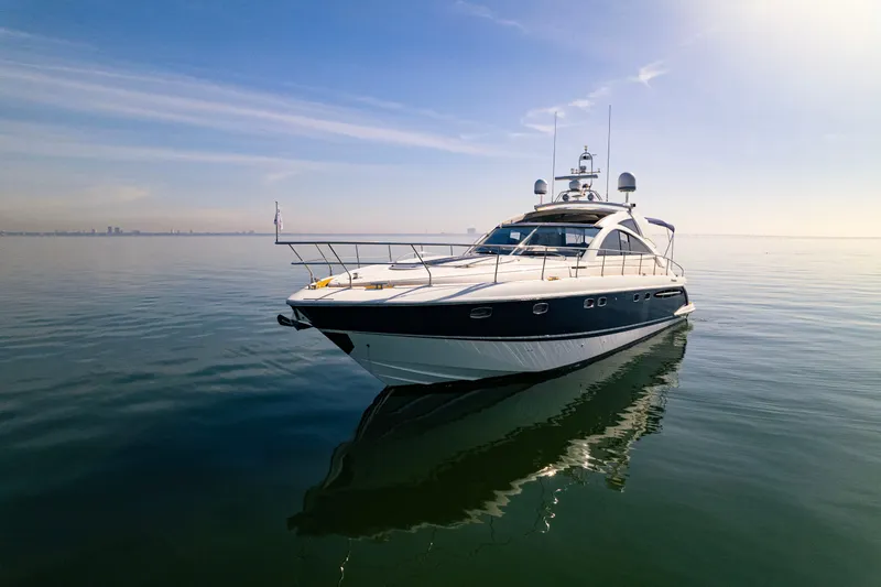 Just-us Yacht Photos Pics 2009 Fairline Targa 52 yacht on calm sea under clear sky.