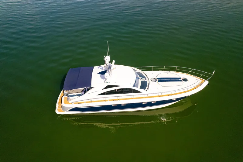 Just-us Yacht Photos Pics 2009 Fairline Targa 52 yacht cruising on calm green waters.