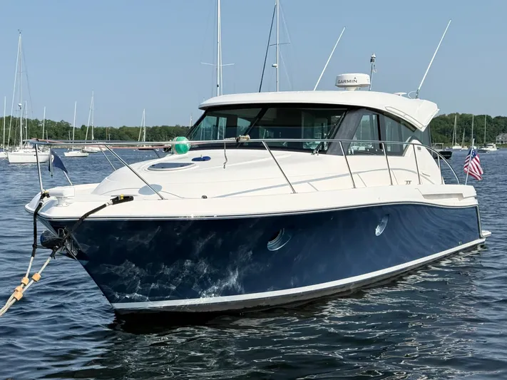 Silver Lining, Name Reserved Yacht Photos Pics 2017 Tiara Yachts 39 Coupe in water, sleek design, American flag displayed.